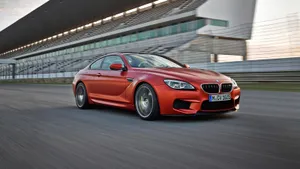 Sleek Bmw M6 In Motion Wallpaper