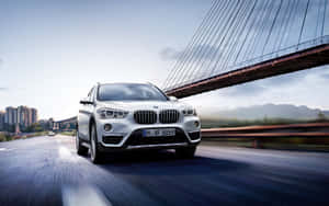 Sleek Bmw X1 On The Open Road Wallpaper