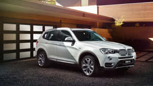 Sleek Bmw X3 On A Picturesque Road Wallpaper