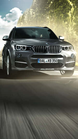 Sleek Bmw X3 On Open Road Wallpaper