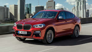 Sleek Bmw X4 In Motion Wallpaper