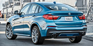 Sleek Bmw X4 In Motion Wallpaper