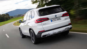 Sleek Bmw X5 In A Stunning Landscape Wallpaper