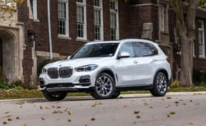 Sleek Bmw X5 In Urban Setting Wallpaper