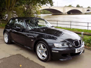 Sleek Bmw Z3 Roadster Cruising On An Open Road Wallpaper