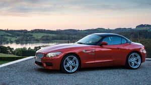 Sleek Bmw Z4 Roadster At Sunset Wallpaper