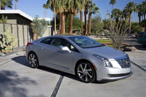 Sleek Cadillac Elr On Scenic Road Wallpaper