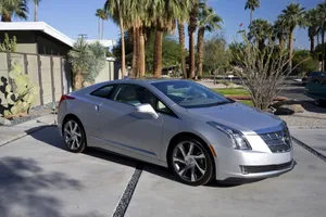 Sleek Cadillac Elr On Scenic Road Wallpaper