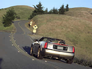 Sleek Cadillac Xlr Cruising The Streets Wallpaper