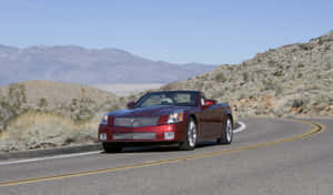 Sleek Cadillac Xlr On The Open Road Wallpaper