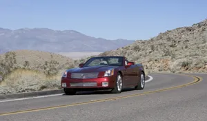 Sleek Cadillac Xlr On The Open Road Wallpaper