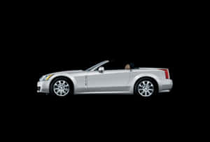 Sleek Cadillac Xlr On The Road Wallpaper
