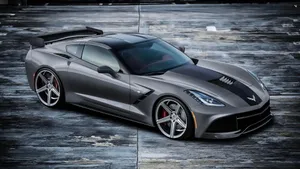 Sleek Chevrolet Corvette C7 On The Open Road Wallpaper