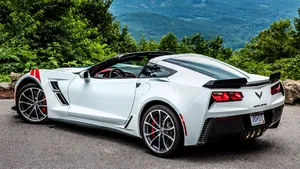 Sleek Chevrolet Corvette Grand Sport On Open Road Wallpaper