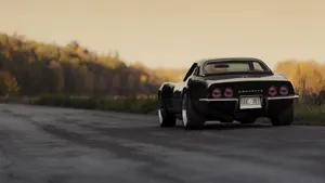 Sleek Chevrolet Corvette Stingray In Action Wallpaper