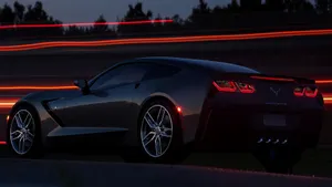 Sleek Chevrolet Corvette Stingray On The Road Wallpaper