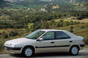 Sleek Citroen Xantia Moving On The Highway Wallpaper