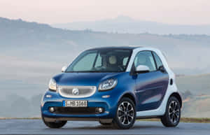 Sleek Compact Car In Urban Setting Wallpaper