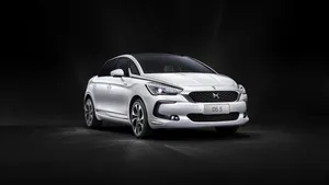 Sleek Ds Automobile On Scenic Road Wallpaper