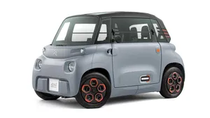 Sleek Electric Vehicle At A Charging Station Wallpaper