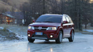 Sleek Elegance Of Fiat Freemont On The Open Road Wallpaper