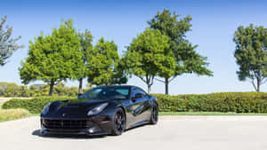 Sleek Ferrari F12 Berlinetta In Motion Wallpaper