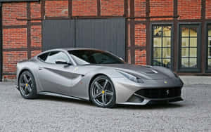 Sleek Ferrari F12 Berlinetta In Motion Wallpaper