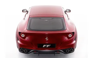 Sleek Ferrari Ff On A Scenic Road Wallpaper