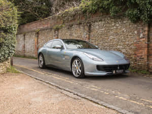 Sleek Ferrari Gtc4lusso In Action Wallpaper