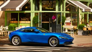 Sleek Ferrari Roma Dominating The Open Road Wallpaper
