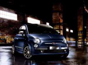 Sleek Fiat 500l Cruising Down The Road Wallpaper