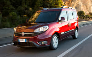 Sleek Fiat Doblo In Natural Environment Wallpaper