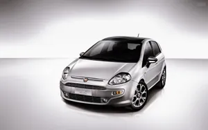 Sleek Fiat Grande Punto In Action Wallpaper