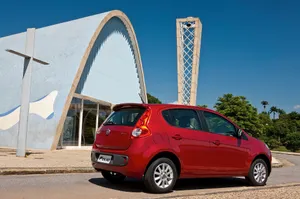 Sleek Fiat Palio In Vibrant Landscape Wallpaper