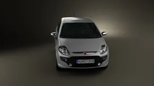 Sleek Fiat Punto In Stunning Urban Backdrop Wallpaper