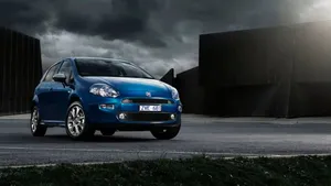 Sleek Fiat Punto Parked On The Street Wallpaper