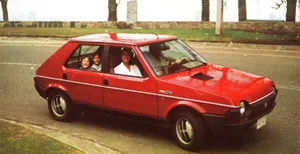 Sleek Fiat Ritmo Gliding On Open Road Wallpaper