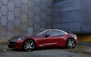 Sleek Fisker Electric Vehicle At Sunset Wallpaper