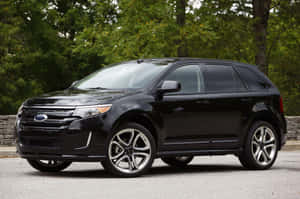 Sleek Ford Edge Cruising On The Open Road. Wallpaper