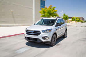 Sleek Ford Escape Gliding Down The Road Wallpaper