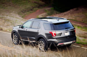 Sleek Ford Explorer On The Road Wallpaper