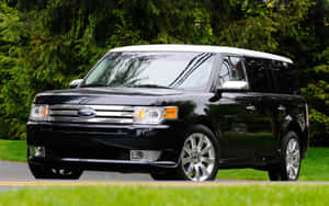 Sleek Ford Flex Cruising On A Scenic Road Wallpaper