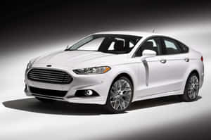 Sleek Ford Fusion Cruising On The Open Road. Wallpaper