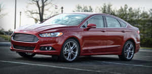 Sleek Ford Fusion In Urban Setting Wallpaper