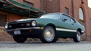 Sleek Ford Maverick Cruising Along A Picturesque Coastline Wallpaper