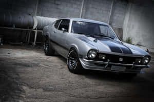 Sleek Ford Maverick Parked On A Scenic Road Wallpaper