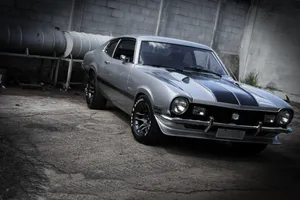 Sleek Ford Maverick Parked On A Scenic Road Wallpaper