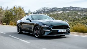 Sleek Ford Mustang Bullitt On The Open Road Wallpaper