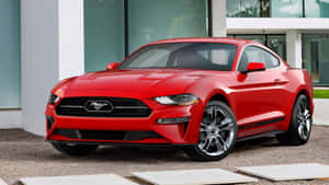 Sleek Ford Mustang California Special Cruising Down The Road Wallpaper