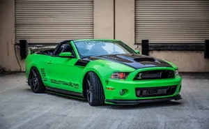 Sleek Ford Mustang Gt Convertible On Open Road Wallpaper